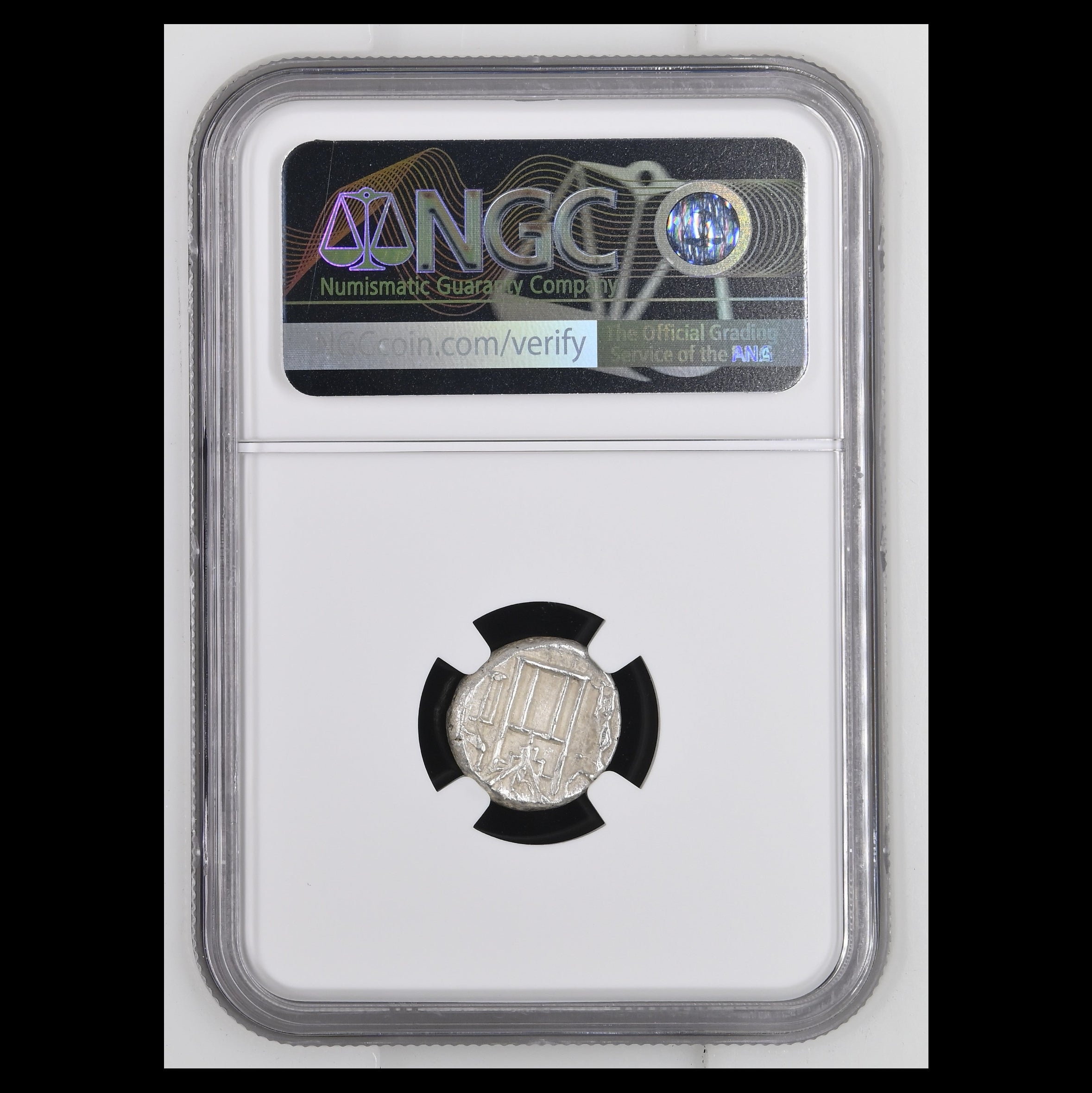A silver coin in a clear NGC grading holder, with the NGC label visible at the top and a black circular insert around the coin.
